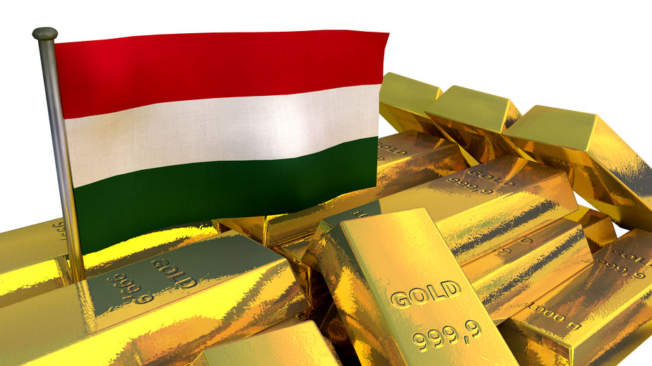 Bandera de Hungría entre lingotes de oro