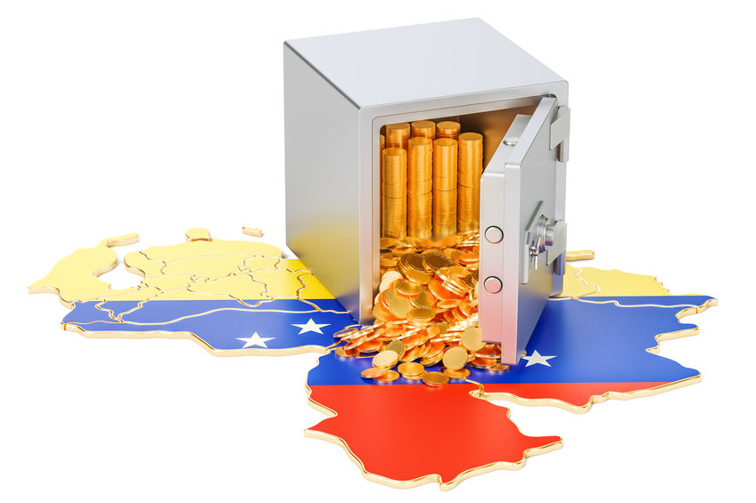 Caja fuerte con monedas de oro y mapa de Venezuela
