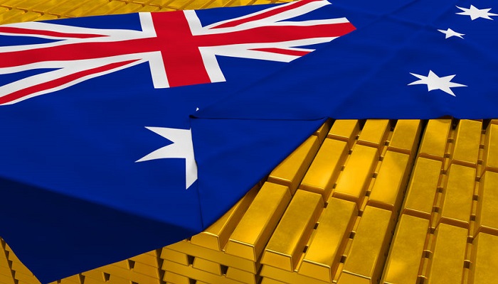 Bandera de Australia cubriendo lingotes de oro