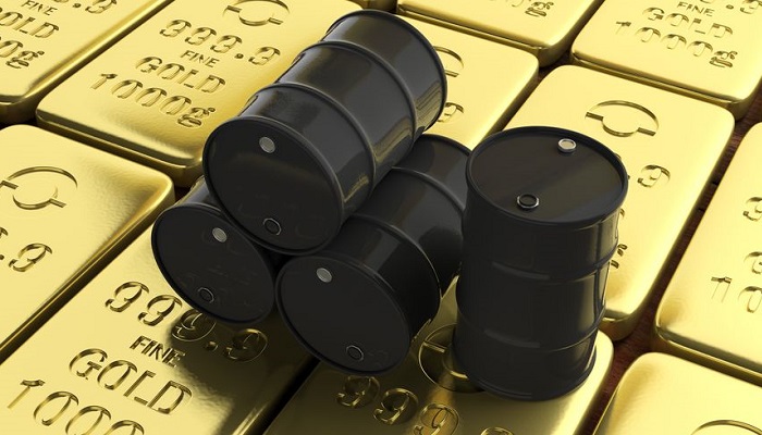 Barriles de petróleo sobre lingotes de oro