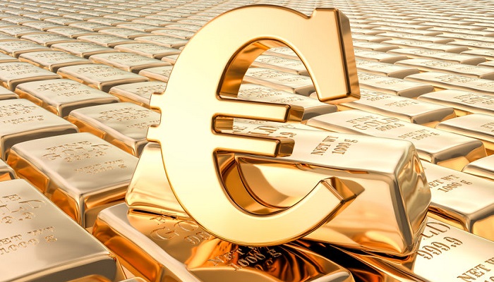 Símbolo del euro sobre lingotes de oro