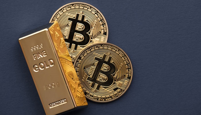 Lingote de oro y bitcoin