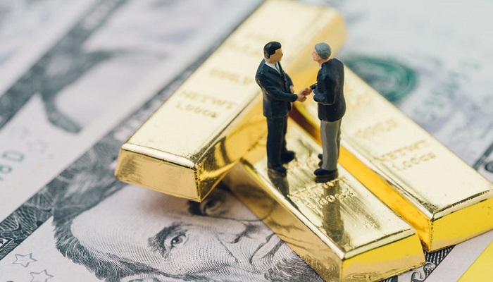 Negociación sobre fondo de oro y dólares