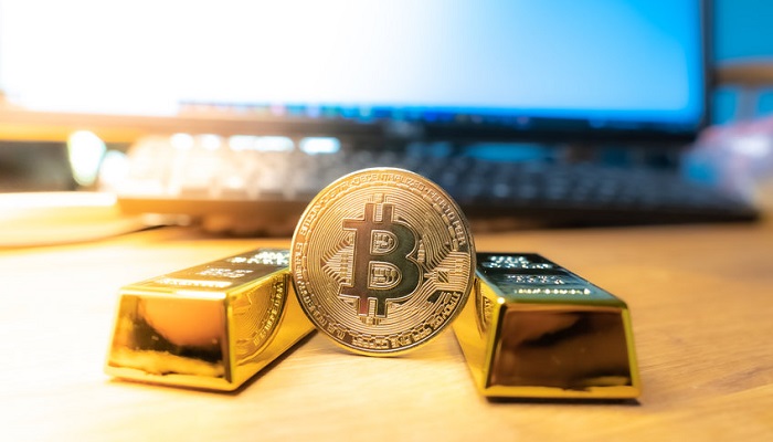 Lingotes de oro con bitcoin