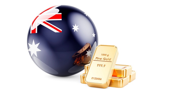 Bandera australiana y lingotes de oro