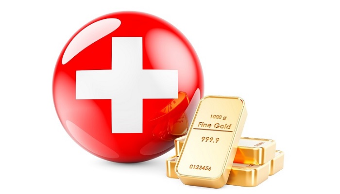 Lingotes de oro y bandera de Suiza